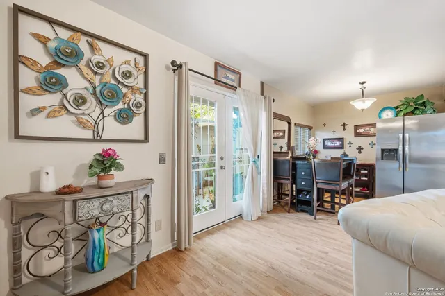 a kitchen with stainless steel appliances kitchen island granite countertop a refrigerator and a sink