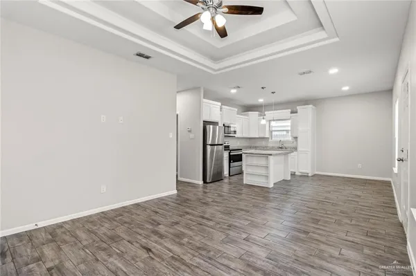 a view of kitchen with wooden floor