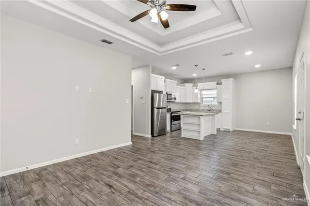 a view of kitchen with wooden floor