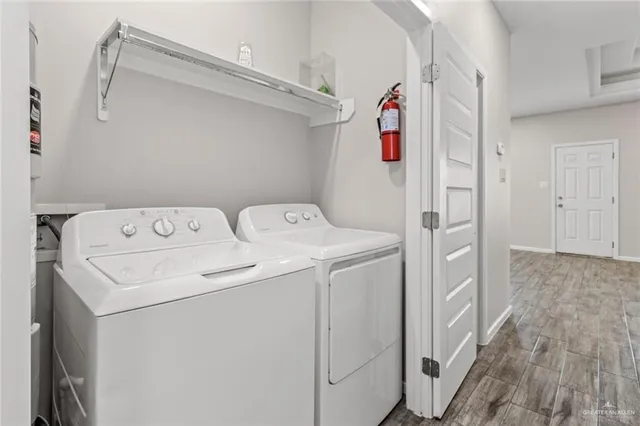 a utility room with dryer and washer