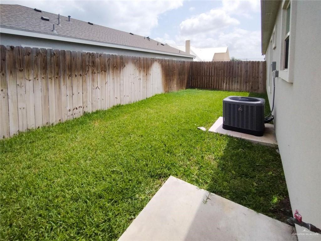 1000 Kentucky Street, Unit 1 Alton, TX 78573 - Photo 10 of 10 a view of a backyard with potted plants