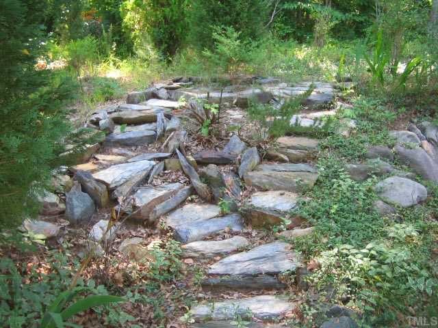 4001 Olde Coach Road Durham, NC 27707 - Photo 11 of 12 Stone path and staircase leads to wooded back yard