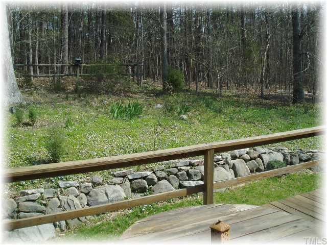 4001 Olde Coach Road Durham, NC 27707 - Photo 10 of 12 Back yard and deck view