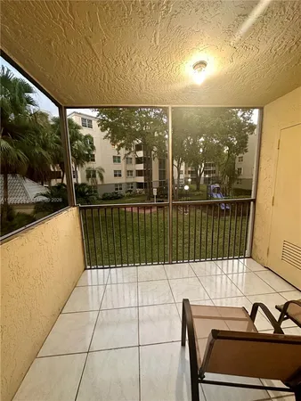 a view of balcony with a potted plant
