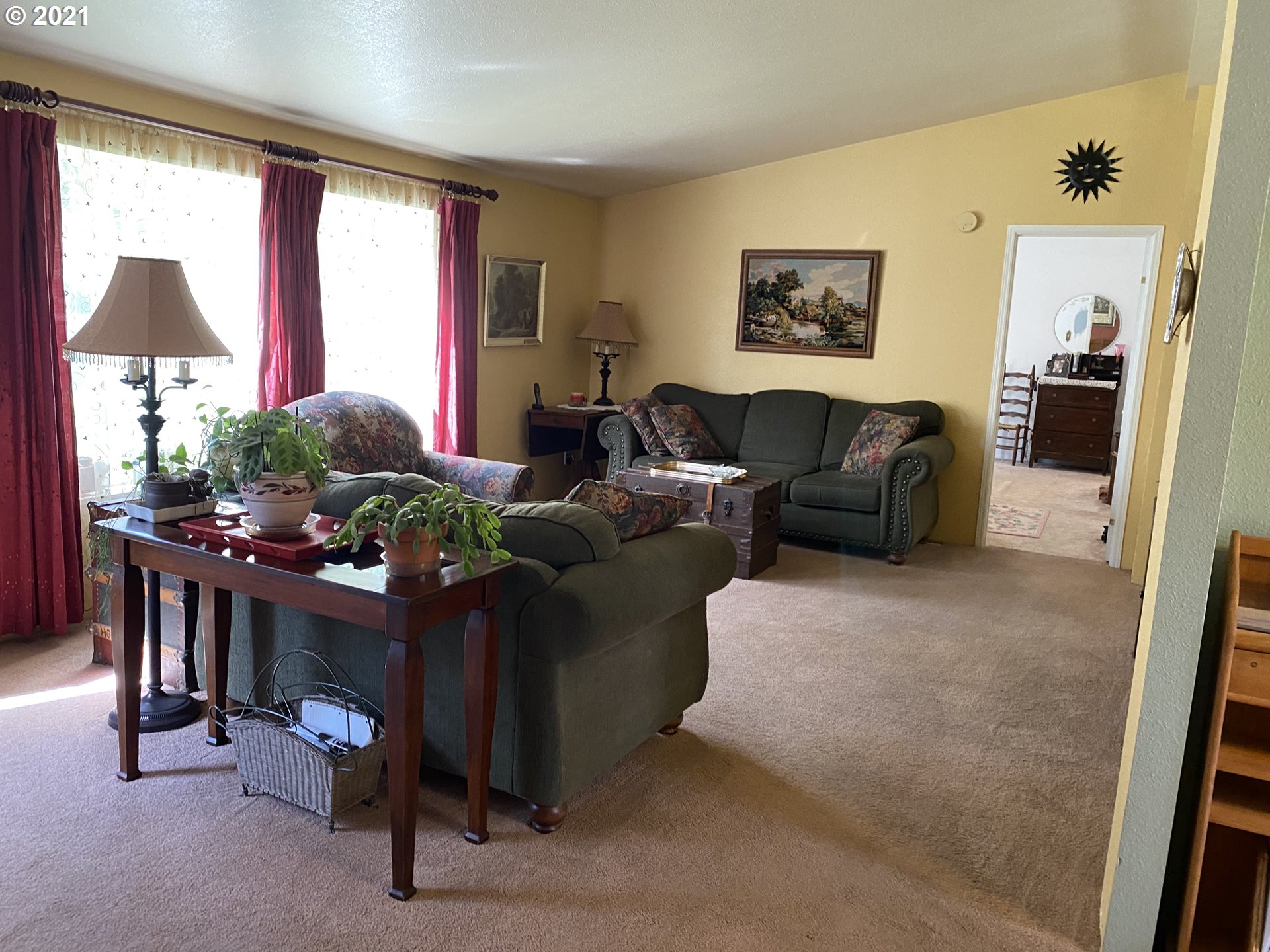 39144 East Knieriem Road Corbett, OR 97019 - Photo 6 of 13 a living room with furniture a window and a flat screen tv
