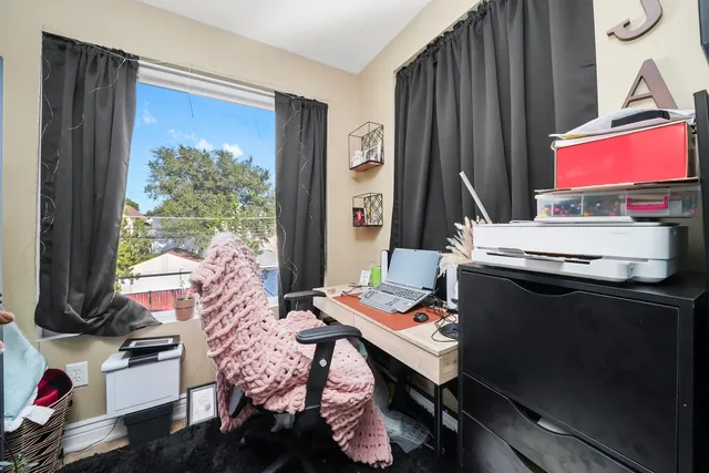 a room with furniture and a window