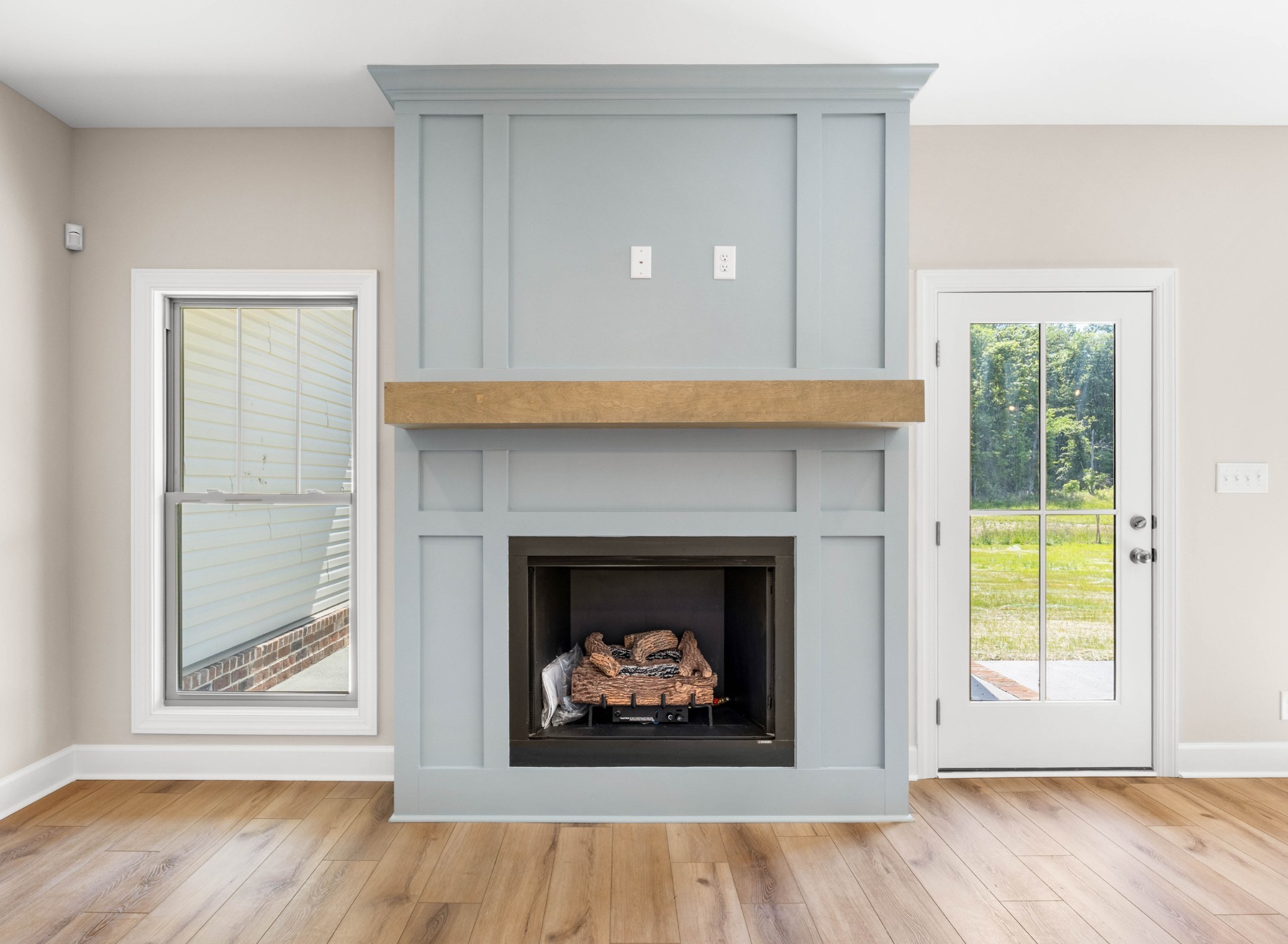 1456 Sango Commons Way Clarksville, TN 37043 - Photo 11 of 49 a living room with a fireplace and a wooden floor