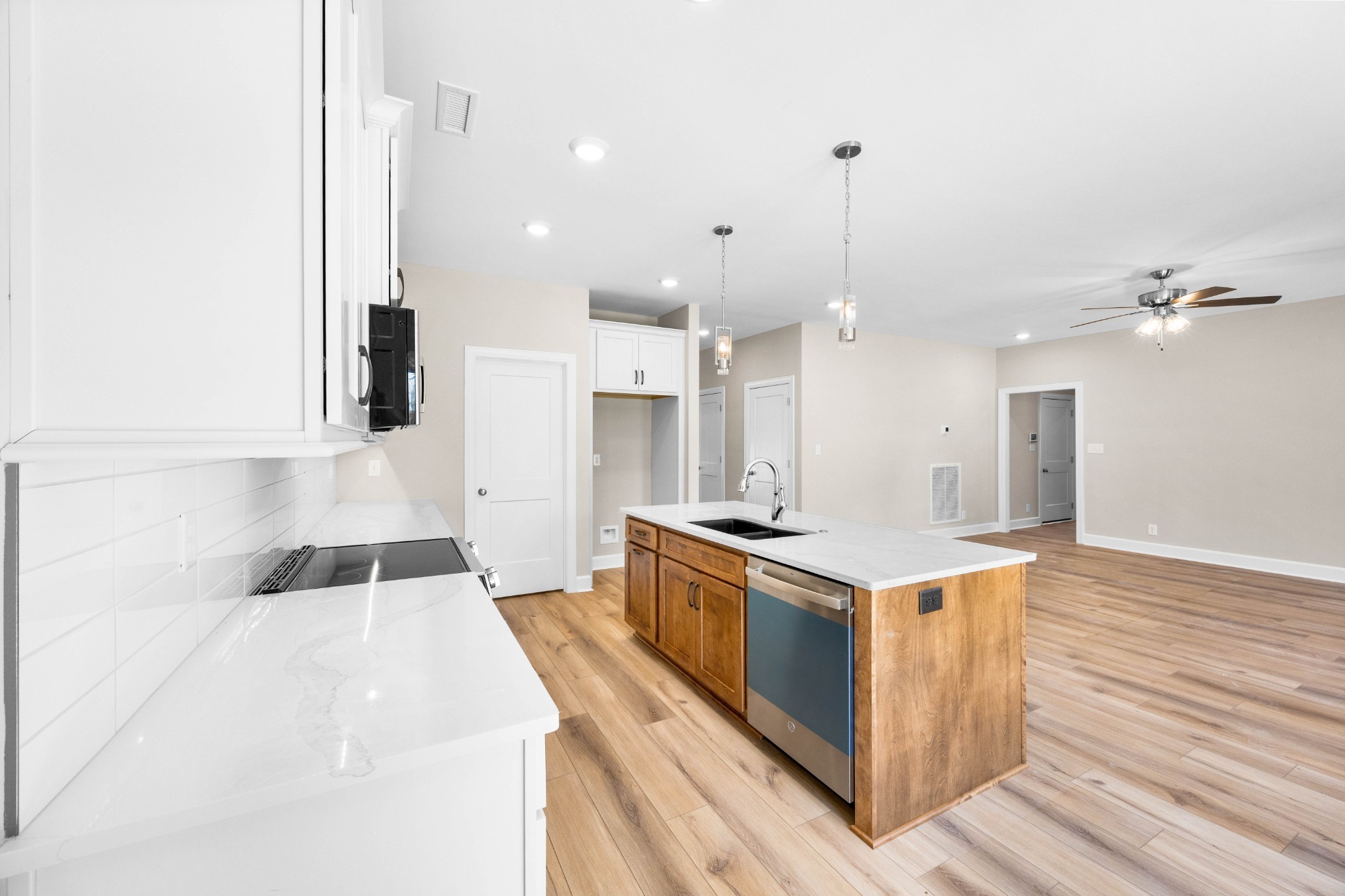 1456 Sango Commons Way Clarksville, TN 37043 - Photo 14 of 49 a kitchen with a stove and a wooden floor