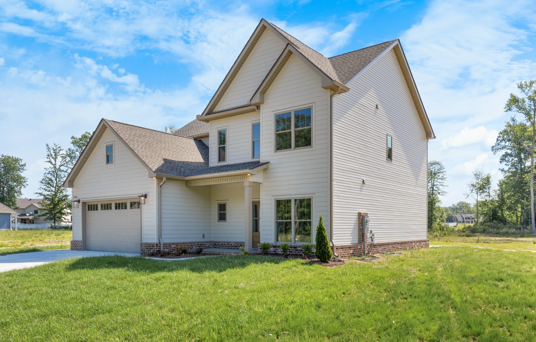 1456 Sango Commons Way Clarksville, TN 37043 - Photo 2 of 49 a front view of a house with a yard