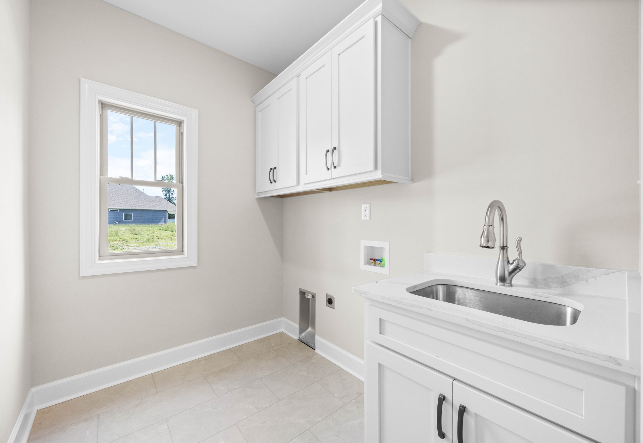1456 Sango Commons Way Clarksville, TN 37043 - Photo 24 of 49 a kitchen with a sink and cabinets