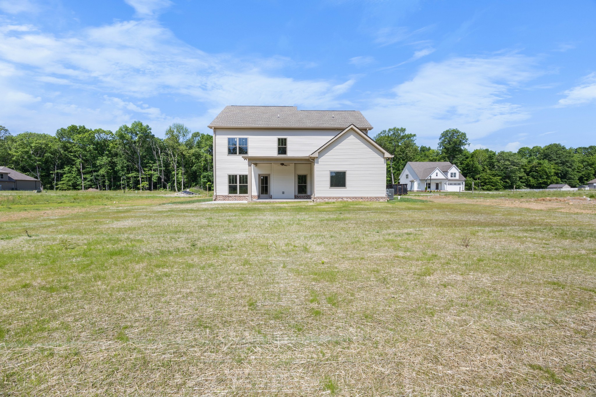 1456 Sango Commons Way Clarksville, TN 37043 - Photo 47 of 49 a big room with table and chairs under an umbrella