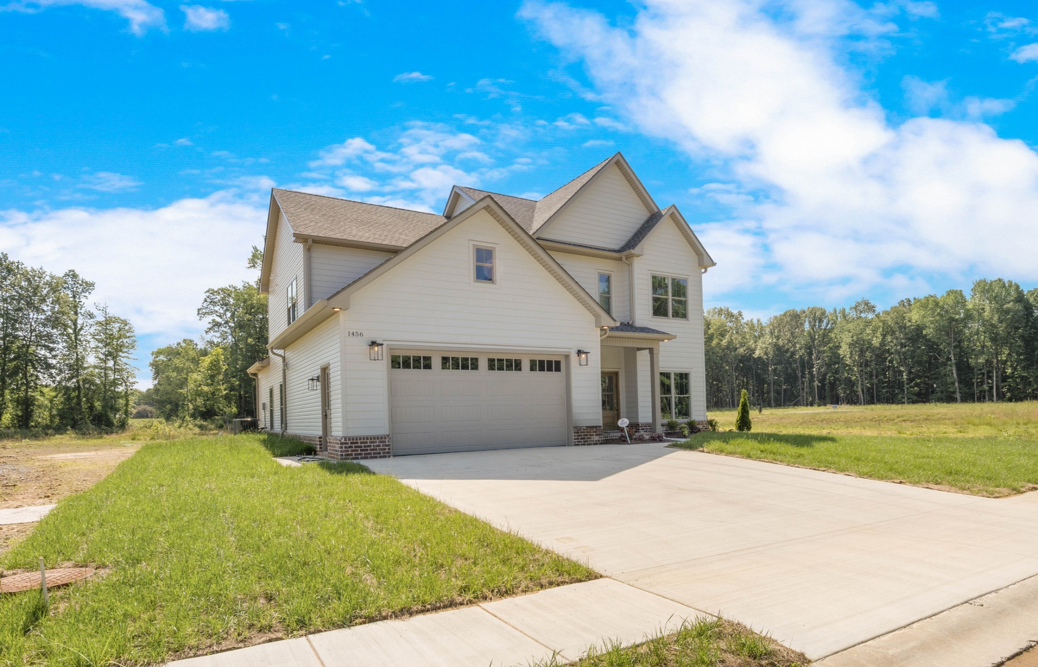 1456 Sango Commons Way Clarksville, TN 37043 - Photo 6 of 49 a view of a house with a big yard plants and large trees