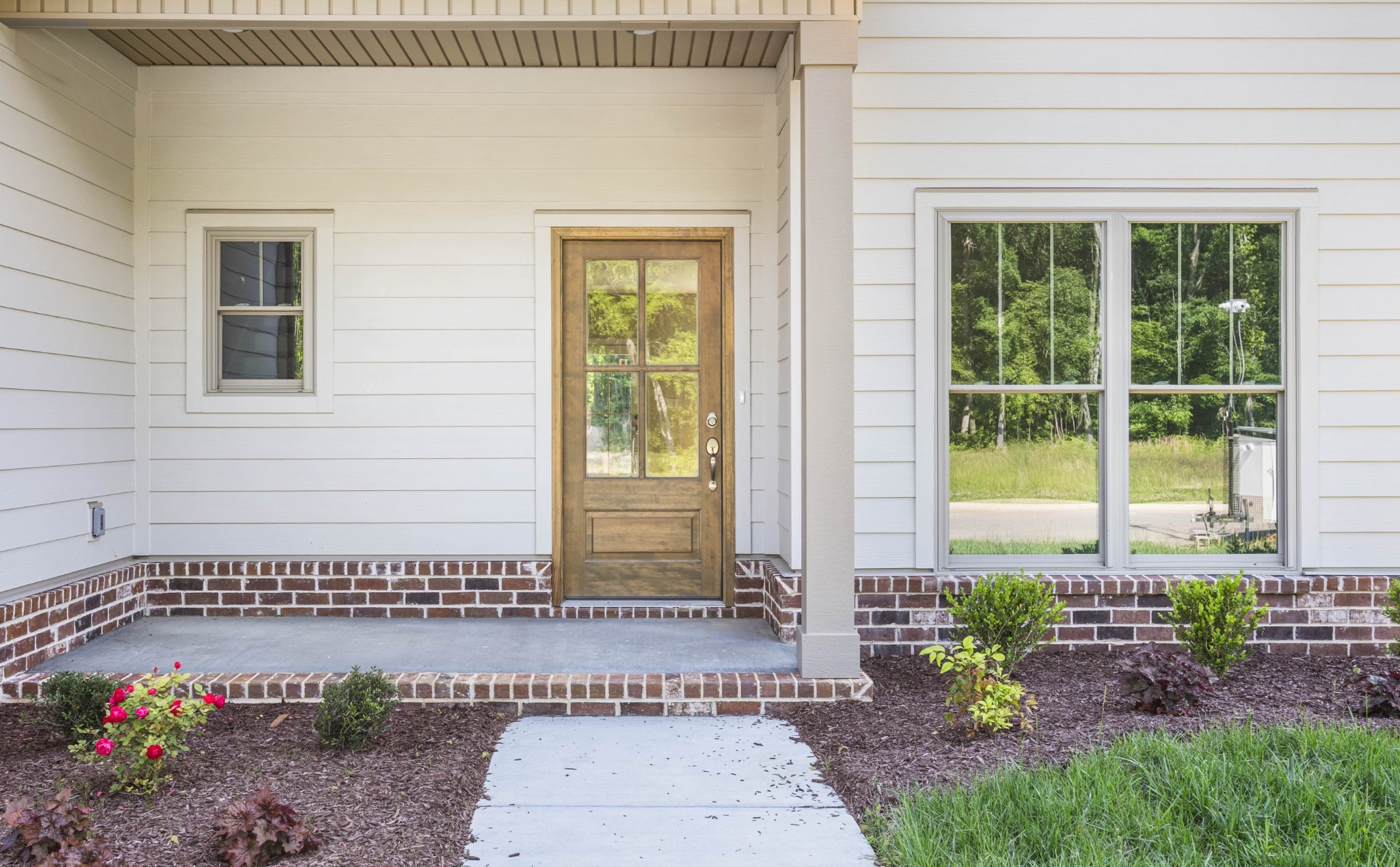 1456 Sango Commons Way Clarksville, TN 37043 - Photo 7 of 49 a front view of a house with a garden
