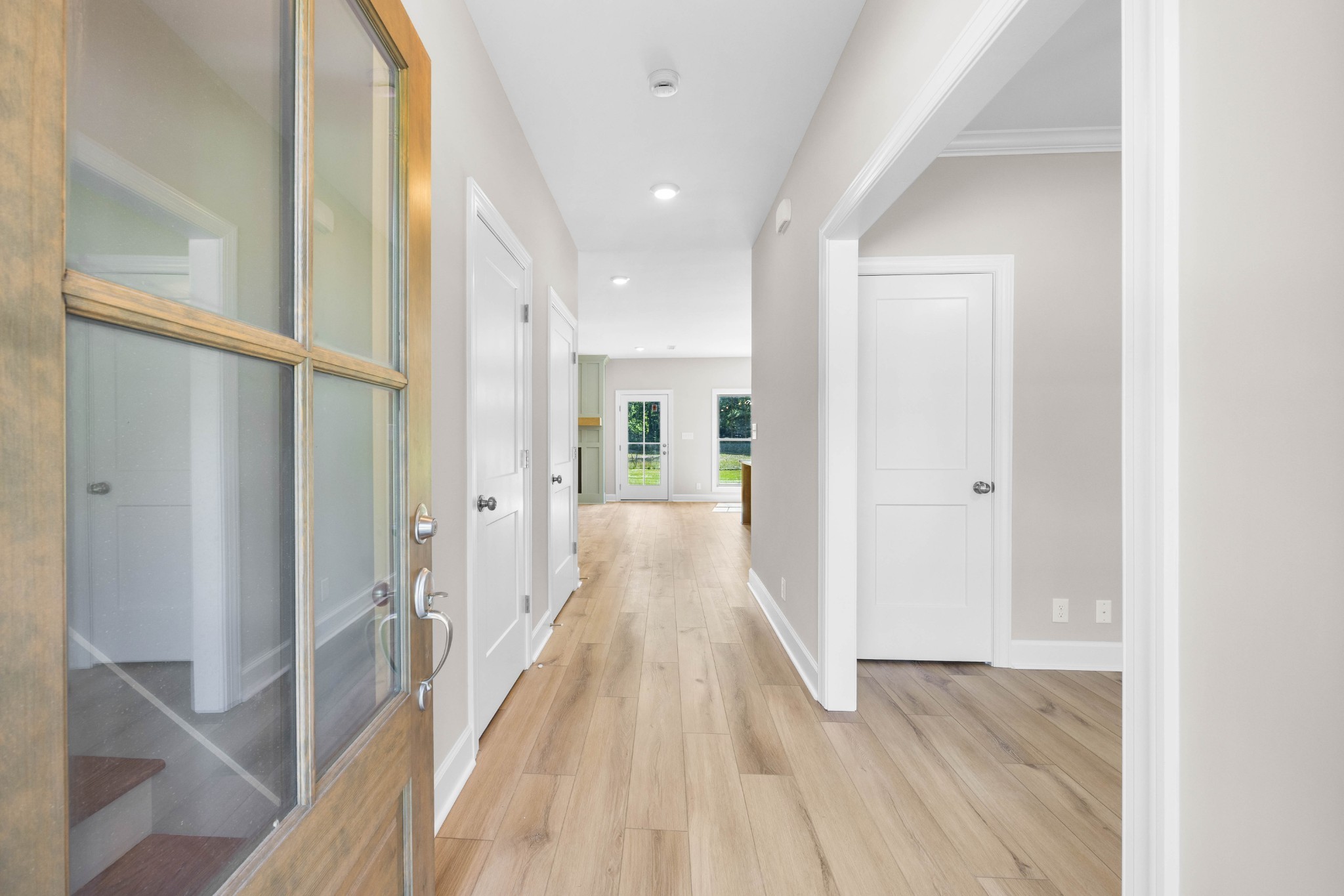 1456 Sango Commons Way Clarksville, TN 37043 - Photo 8 of 49 a view of a hallway with wooden floor