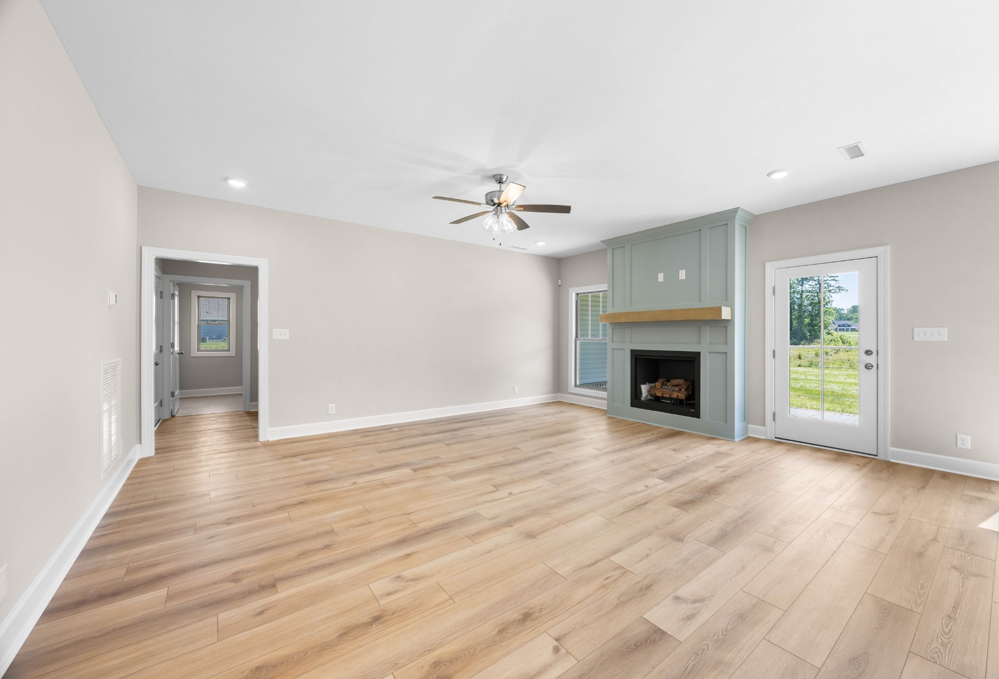 1456 Sango Commons Way Clarksville, TN 37043 - Photo 9 of 49 a view of an empty room with a fireplace and a window