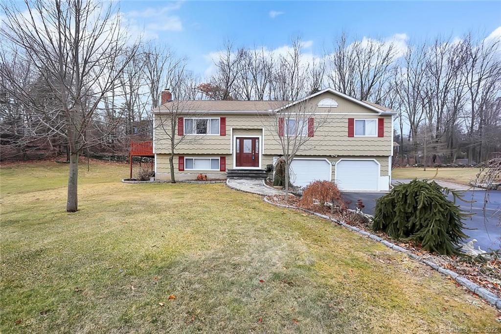 67 Nicholdale Road Shelton, CT 06484 - Photo 1 of 1 a front view of a house with a yard and garage