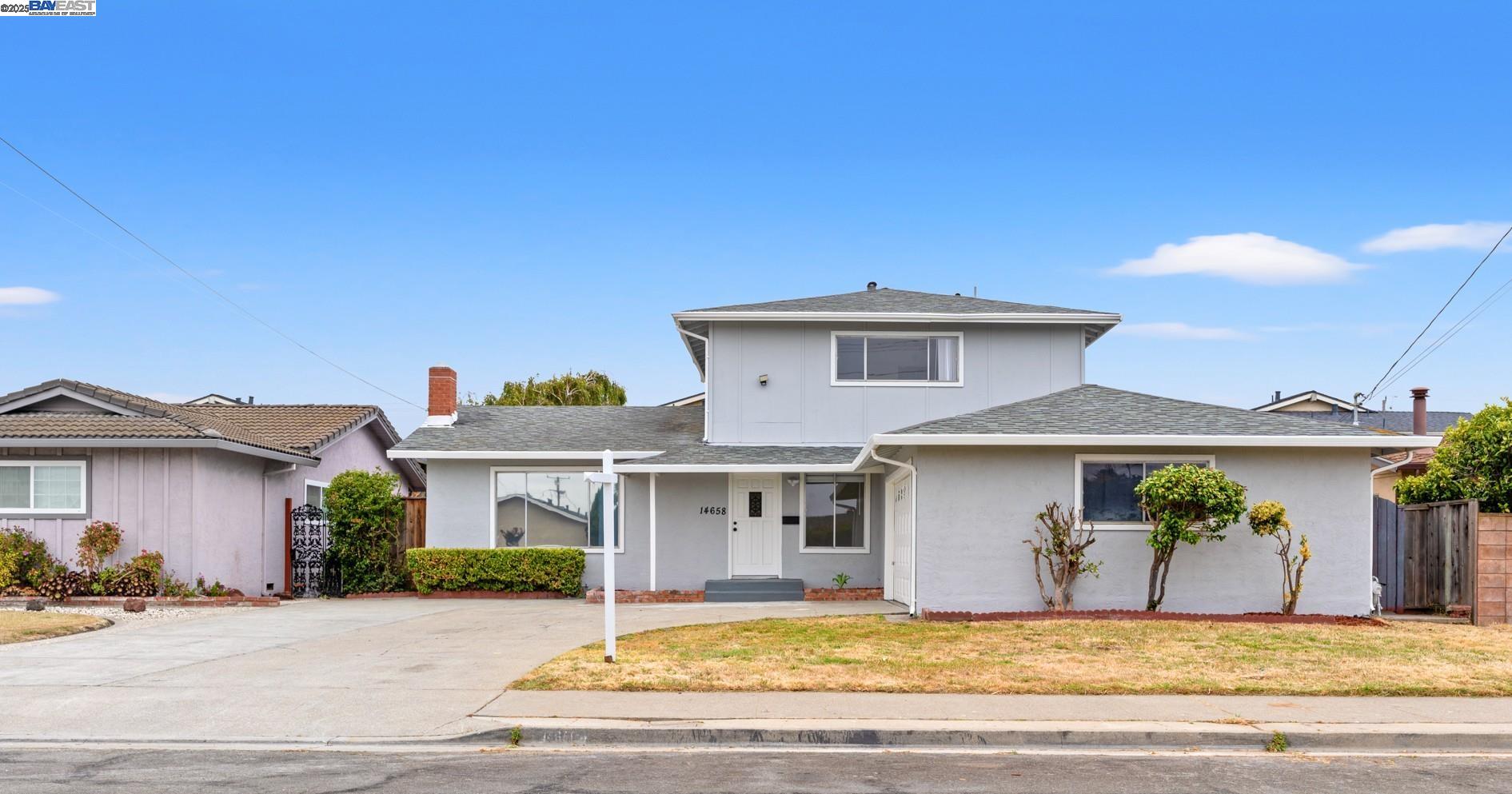 14658 Tiburon Road San Leandro, CA 94577 - Photo 1 of 1 a front view of a house with a garden and yard