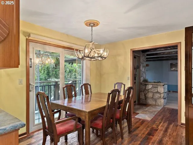 a kitchen with stainless steel appliances granite countertop a sink and a refrigerator