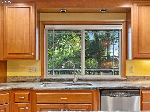 a kitchen with a sink and a window