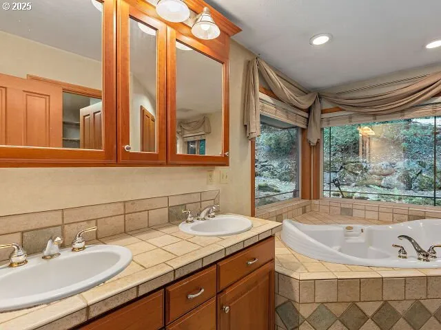 a bath tub sitting in a bathroom next to a window