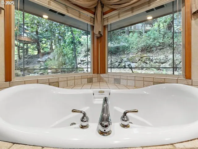 a view of a room with wooden floor and windows