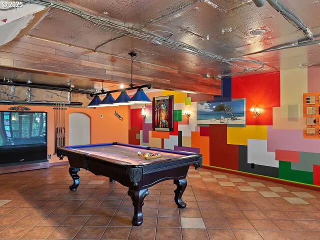 a view of a room with a chandelier and fireplace