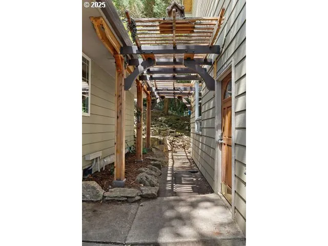 a view of a room with wooden floor and windows