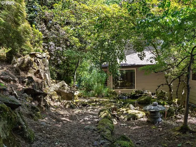 a view of outdoor space and a lake view of residential building