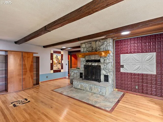 a view of an empty room with a fireplace