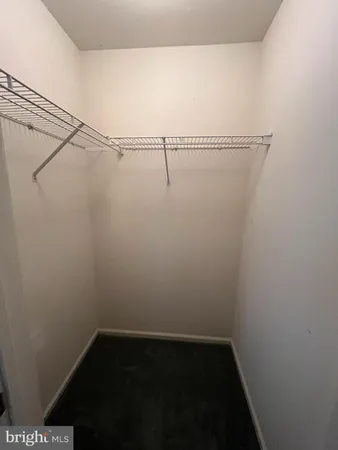 a bathroom with a glass shower door and sink