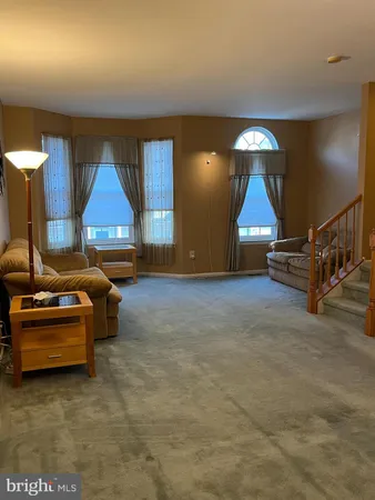 a room with furniture and a lamp