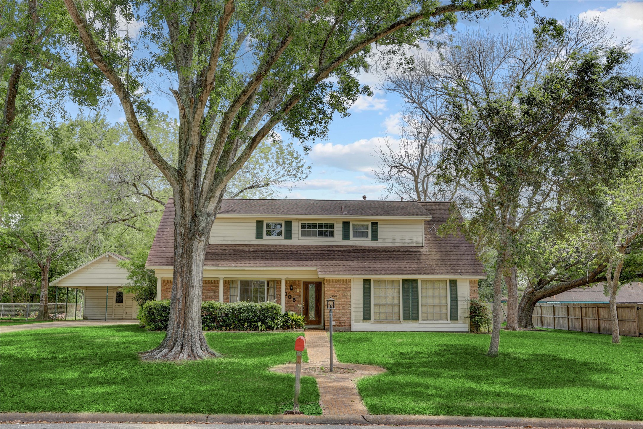 front view of a house with a yard