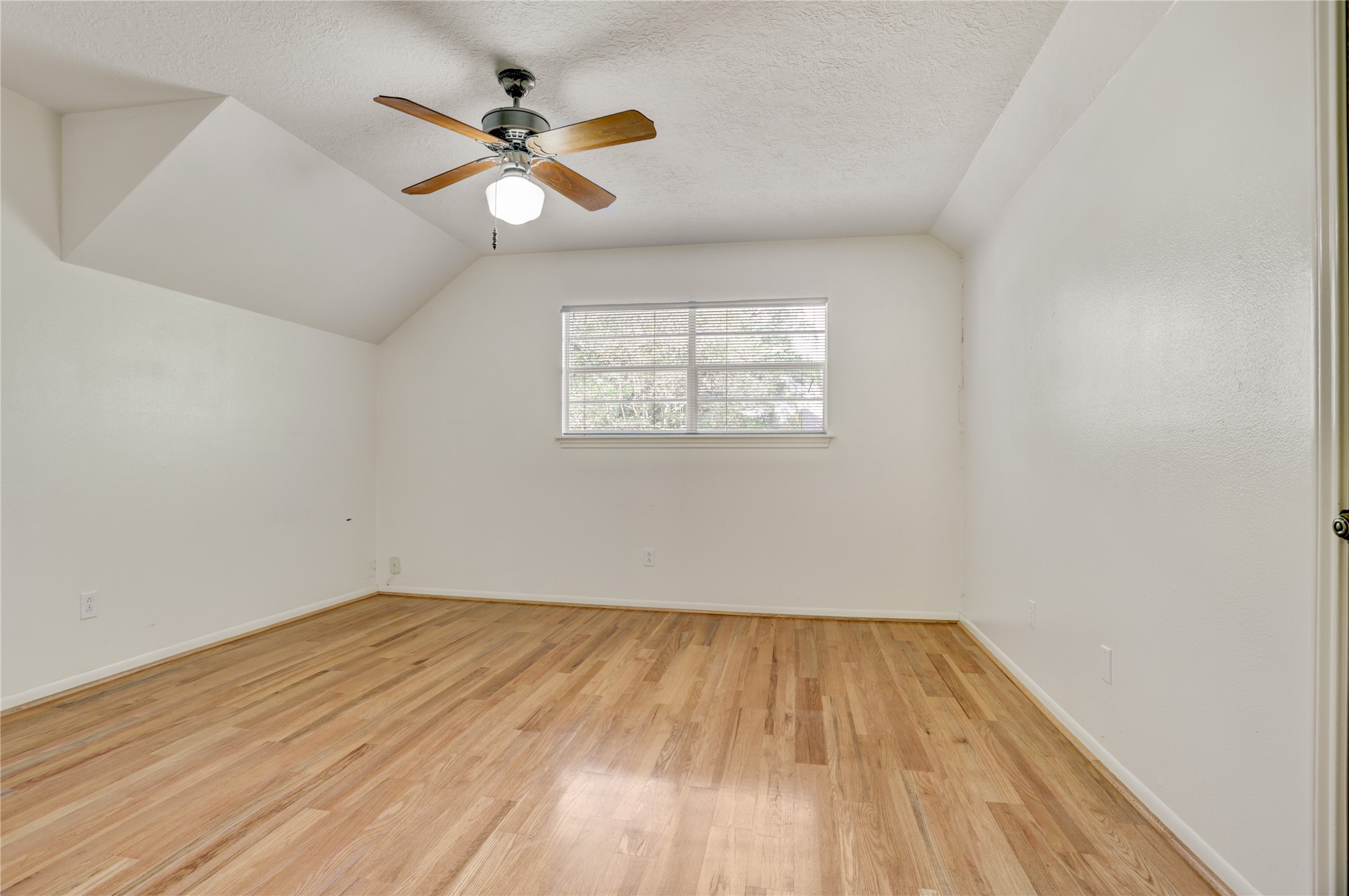 105 Ridgemont Drive Alvin, TX 77511 - Photo 20 of 30 wooden floor in an empty room with a window