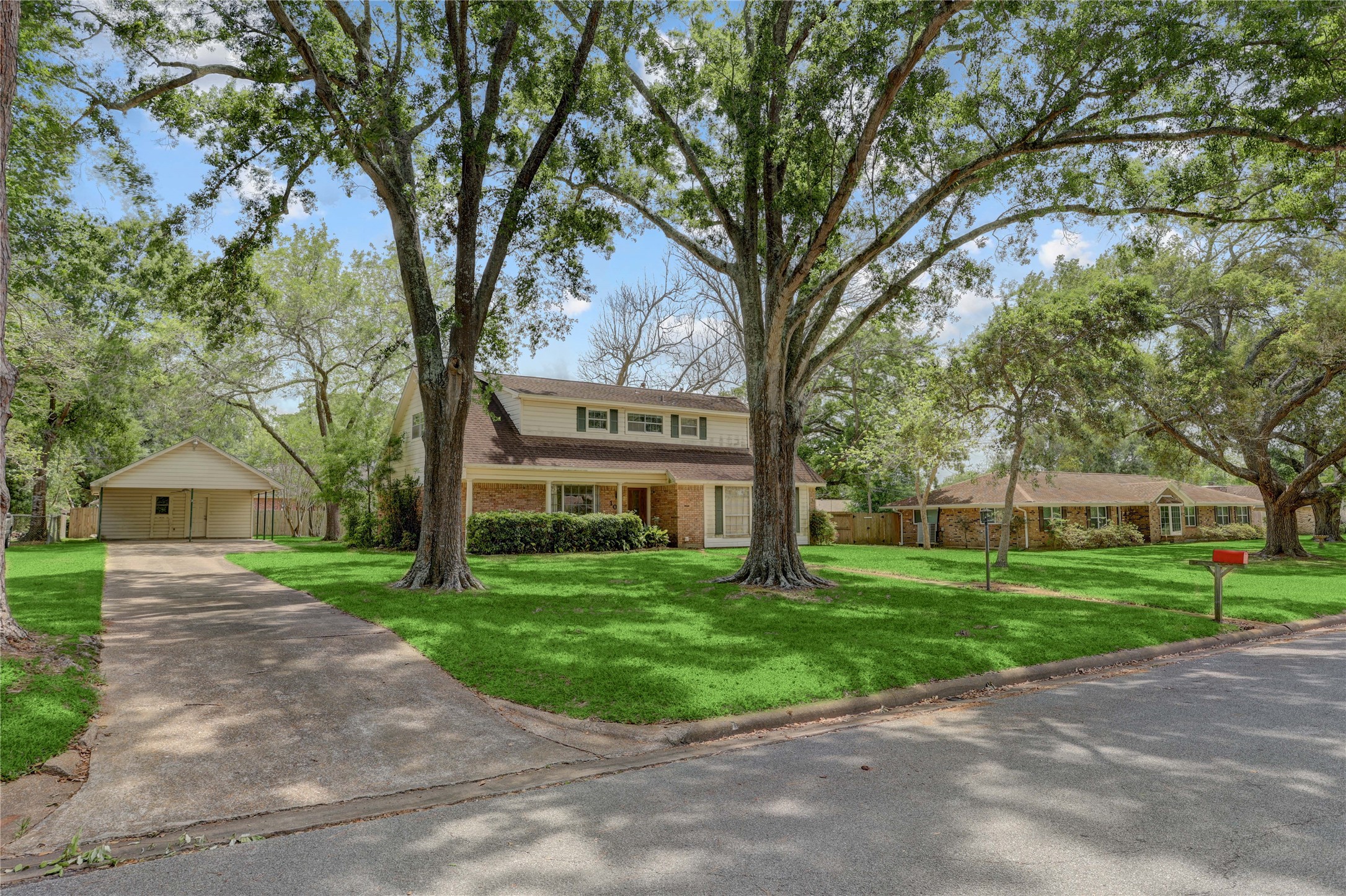 105 Ridgemont Drive Alvin, TX 77511 - Photo 2 of 30 a front view of a house with a yard and trees