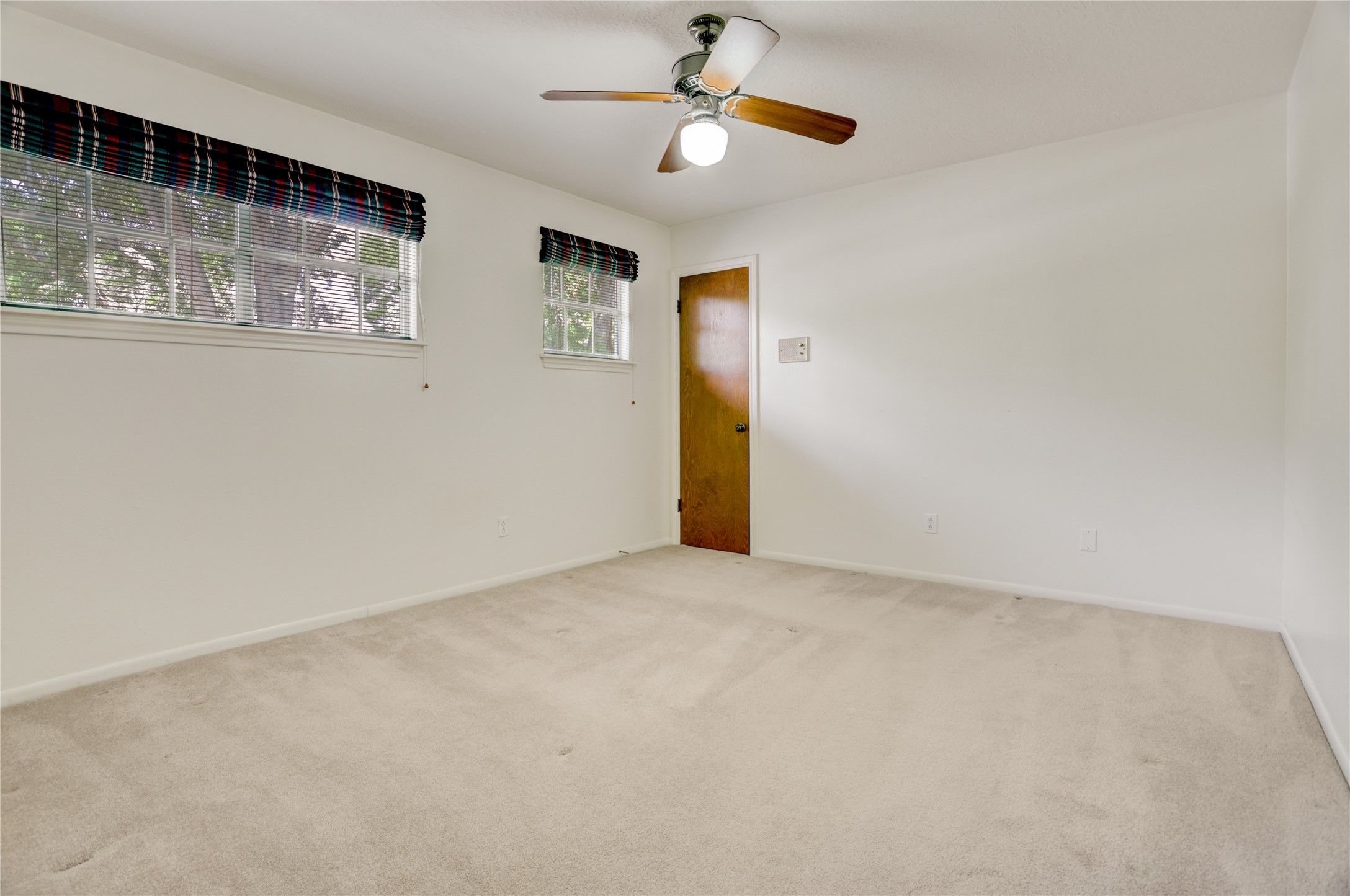 105 Ridgemont Drive Alvin, TX 77511 - Photo 21 of 30 an empty room with windows and fan