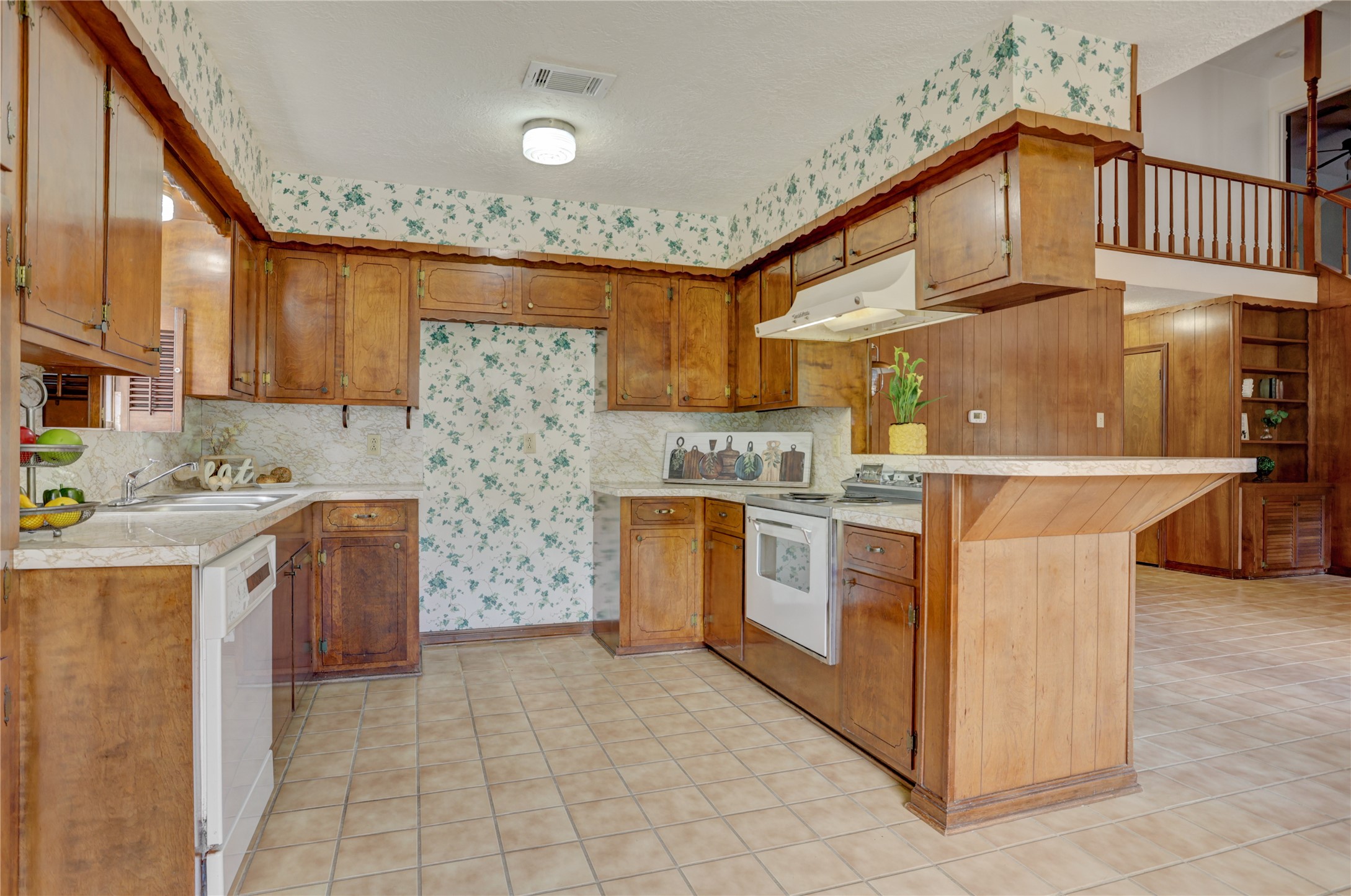 105 Ridgemont Drive Alvin, TX 77511 - Photo 10 of 30 a kitchen with stove and cabinets