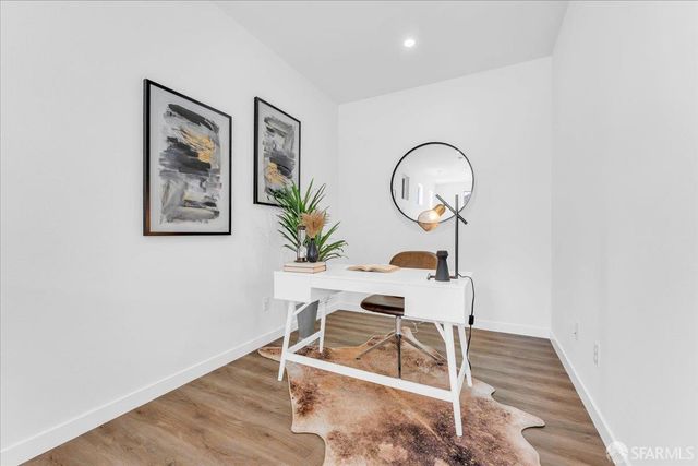 a room with furniture and a potted plant