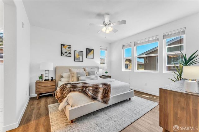 a bedroom with bed and window