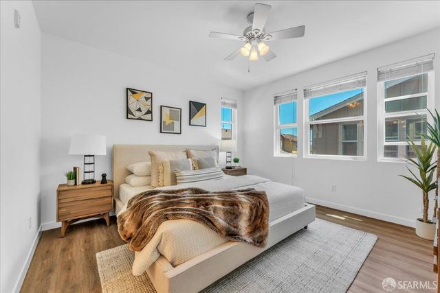 a bedroom with bed and a window