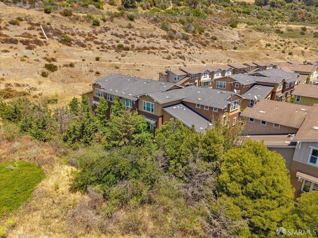 an aerial view of residential house with parking space