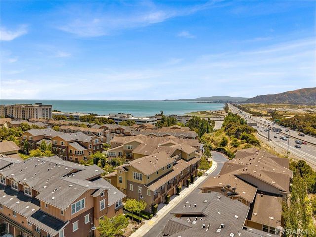 an aerial view of residential building with parking space