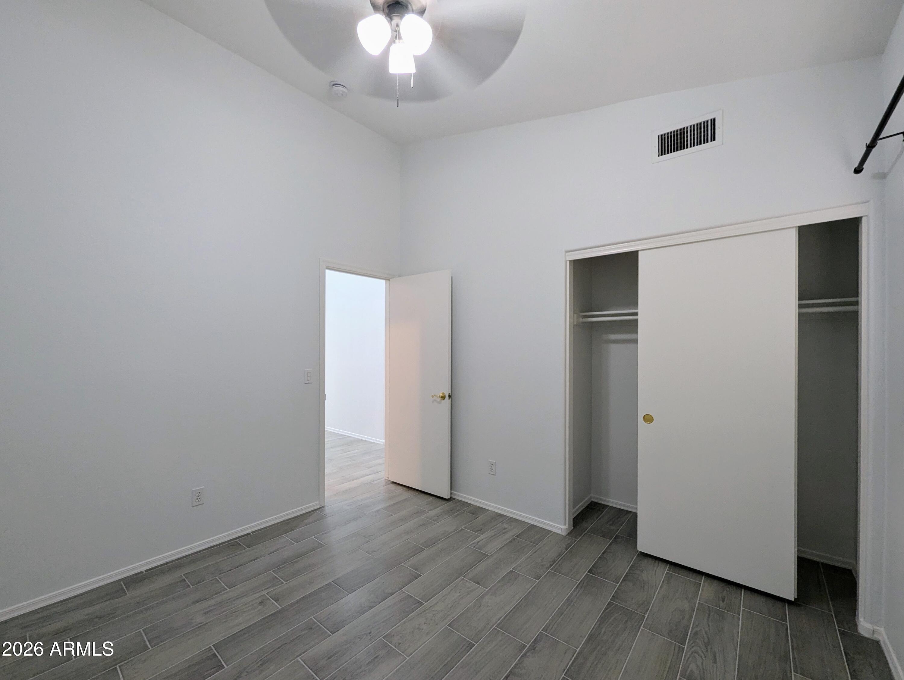 5424 West Wagoner Road Glendale, AZ 85308 - Photo 26 of 37 a view of an empty room with wooden floor