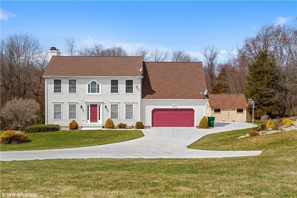 a view of building with street view and tall trees