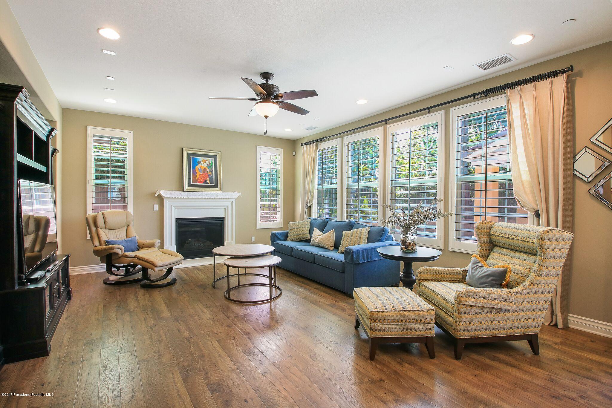 3406 Avondale Road Pasadena, CA 91107 - Photo 13 of 22 a living room with furniture a fireplace and a floor to ceiling window