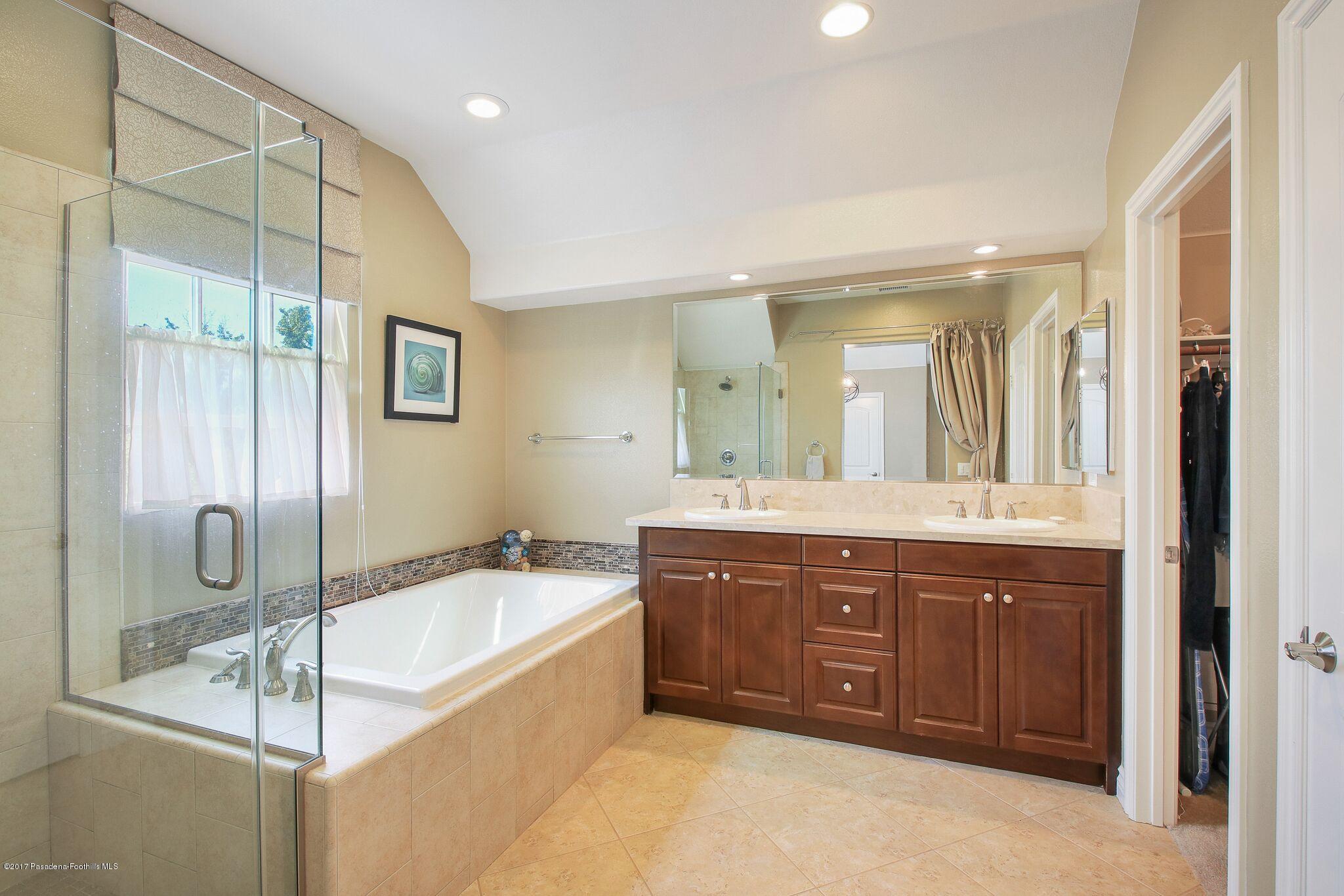 3406 Avondale Road Pasadena, CA 91107 - Photo 16 of 22 a spacious bathroom with a tub sink shower and mirror