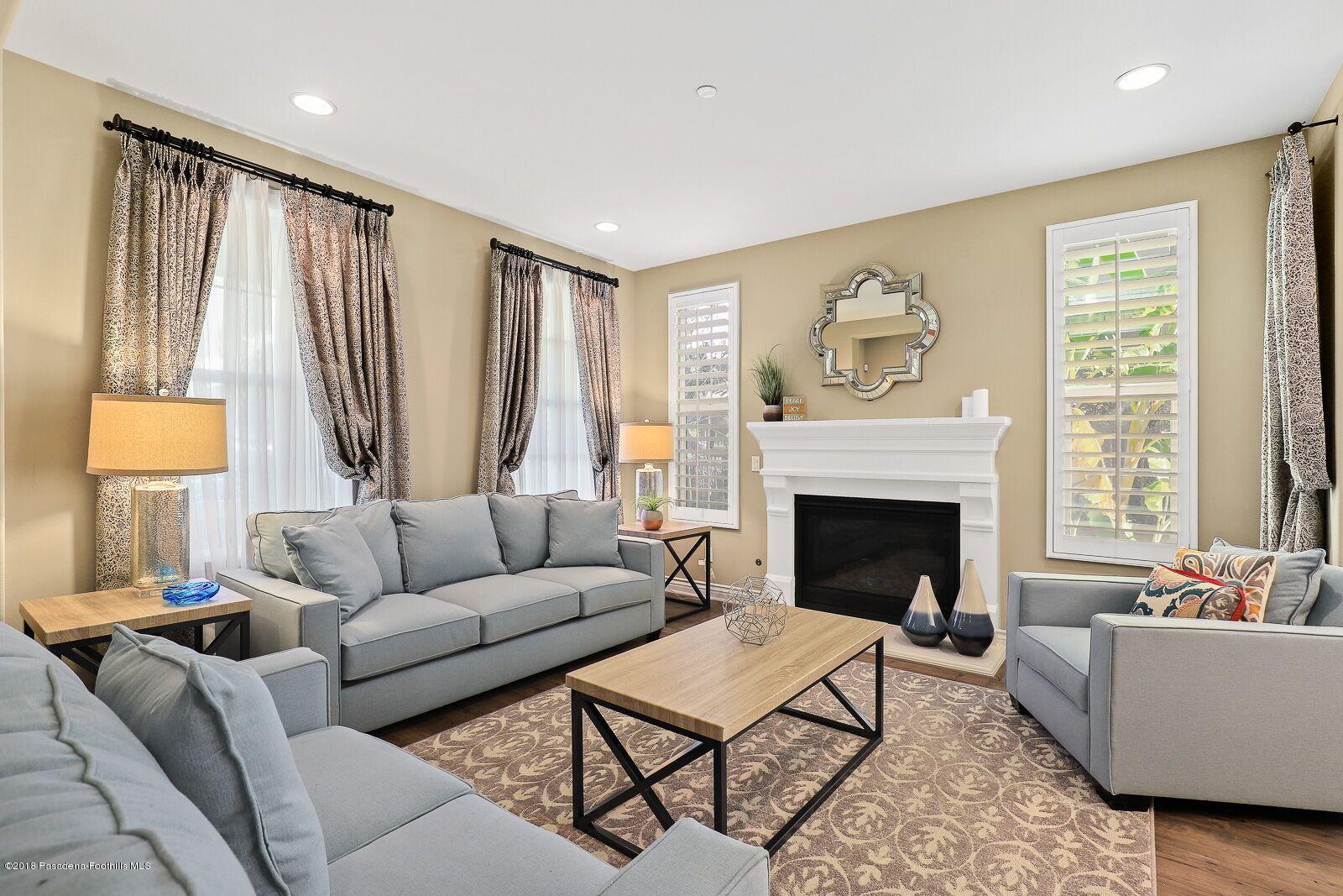 3406 Avondale Road Pasadena, CA 91107 - Photo 2 of 22 a living room with furniture and a fireplace