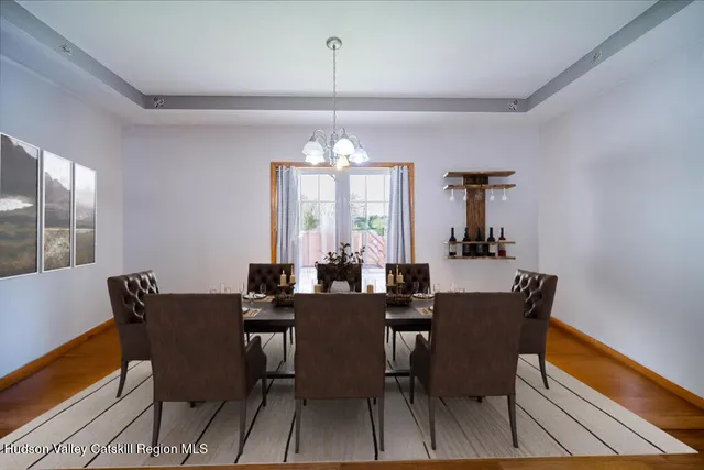 a bathroom with a granite countertop sink mirror vanity and toilet