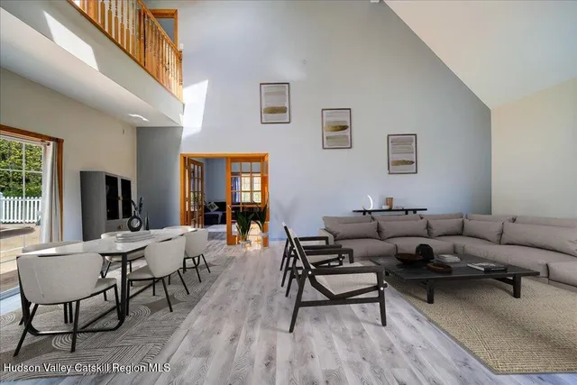 a kitchen with granite countertop wooden floors and stainless steel appliances
