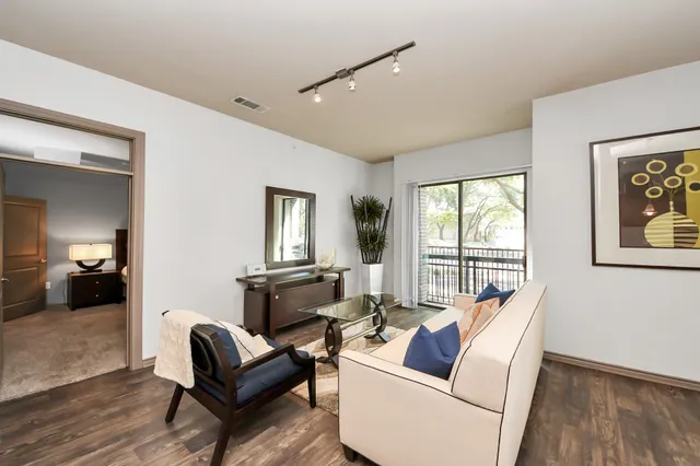 a bedroom with a large bed and a tv