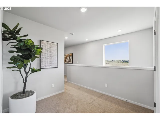 a spacious bedroom with a bed and window
